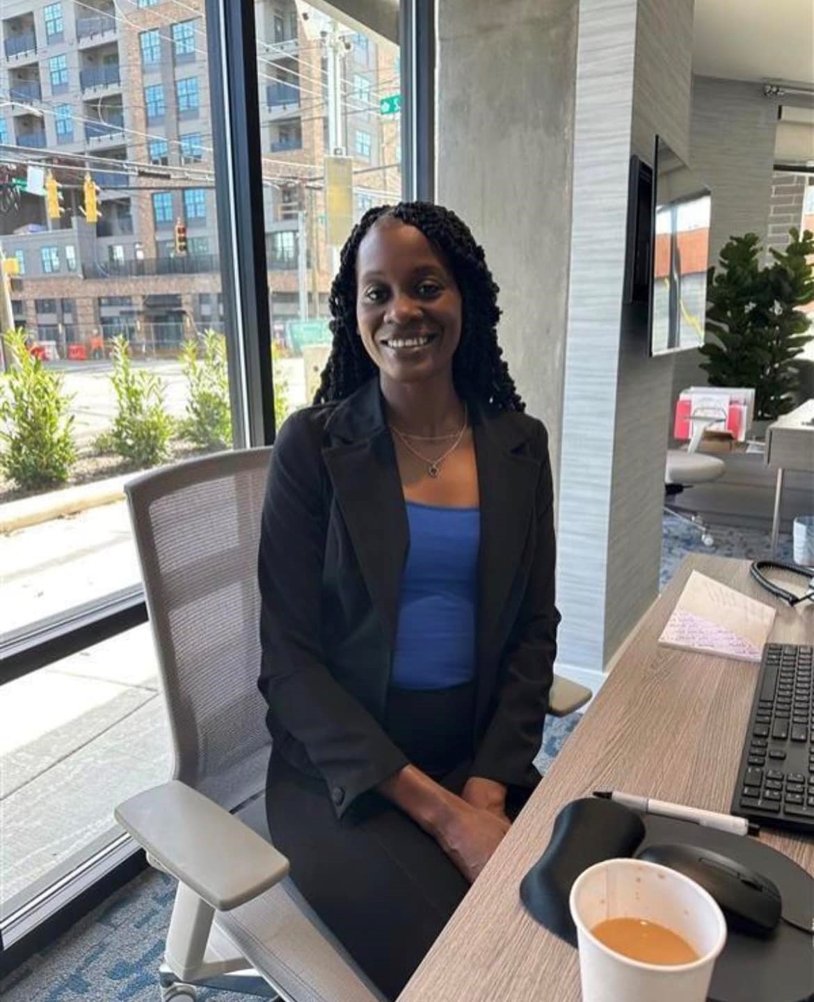 Lakisha sitting at desk in leasing office